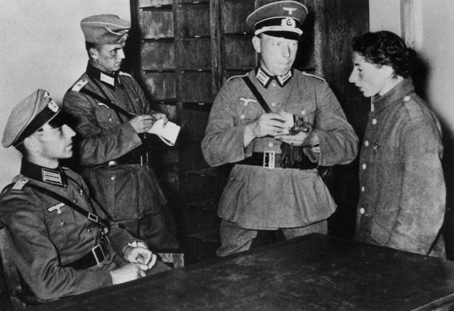 A young jew is interrogated by the SS in Warsaw